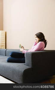 Pregnant woman reading a book