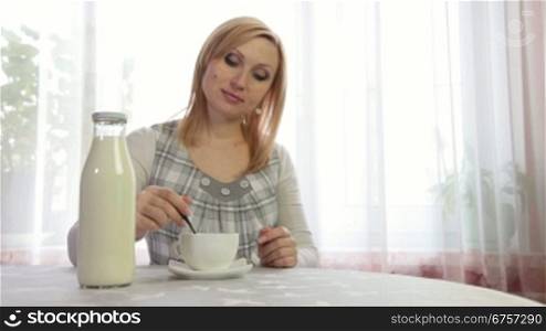 Pregnant Woman relaxing with Cup of Tea