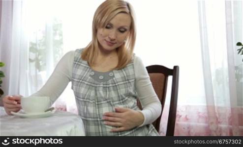 Pregnant Woman relaxing with Cup of Tea