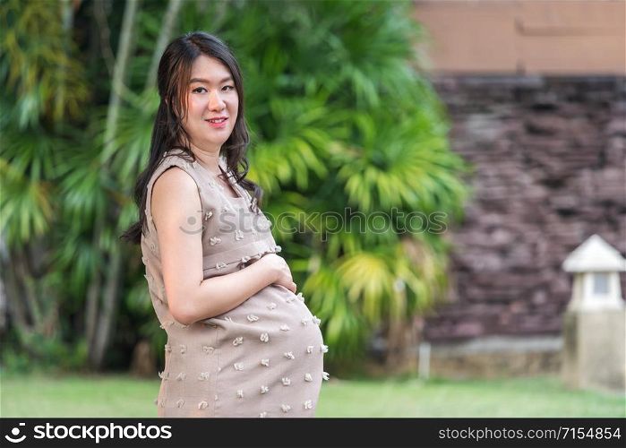 pregnant woman resting in the garden