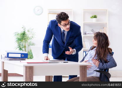 Pregnant woman struggling in the office and getting colleague help. Pregnant woman struggling in the office and getting colleague he