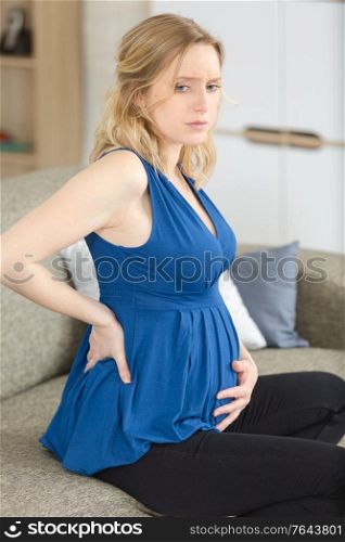 pregnant woman suffering belly ache