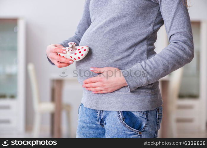 Pregnant woman taking pills during pregnancy