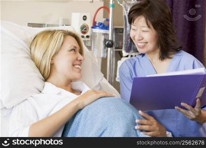 Pregnant Woman Talking To Doctor