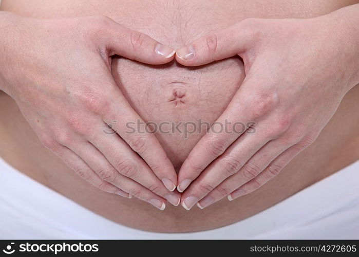 Pregnant woman touching belly