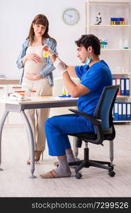 Pregnant woman visiting doctor for check-up