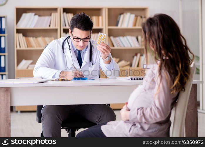 Pregnant woman visiting doctor for consultation