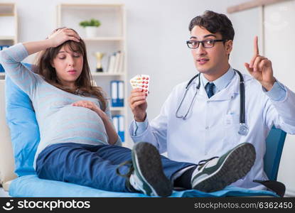 Pregnant woman visiting doctor for consultation