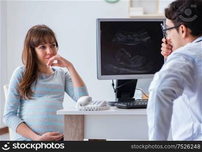 Pregnant woman visiting doctor for regular check-up. The pregnant woman visiting doctor for regular check-up