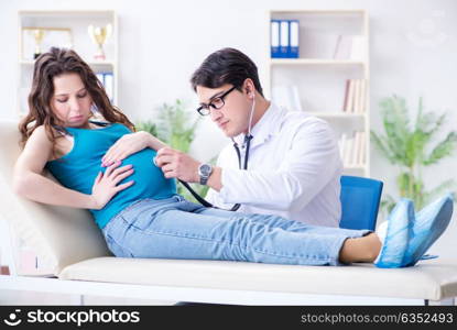 Pregnant woman visiting doctor in medical concept