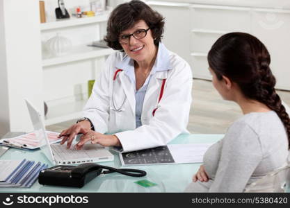 pregnant woman visiting her doctor