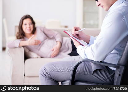 Pregnant woman visiting psychologist doctor. The pregnant woman visiting psychologist doctor