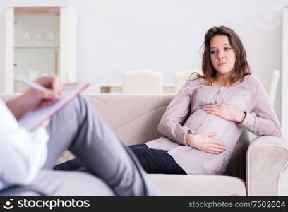 Pregnant woman visiting psychologist doctor. The pregnant woman visiting psychologist doctor