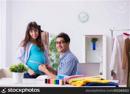 Pregnant woman visiting tailor for new clothing