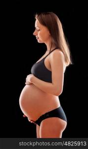 Pregnant woman with black background
