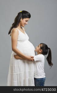 Pregnant woman with daughter