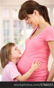 Pregnant woman with daughter
