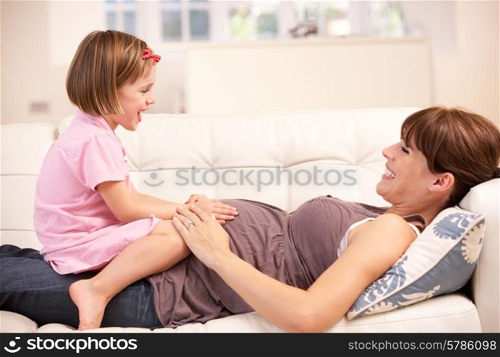 Pregnant woman with daughter