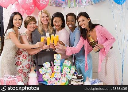 Pregnant Woman with friends at a Baby Shower