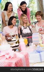 Pregnant Woman with friends at a Baby Shower