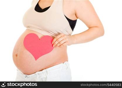 Pregnant woman with heart on her belly isolated on white. Close-up.&#xA;