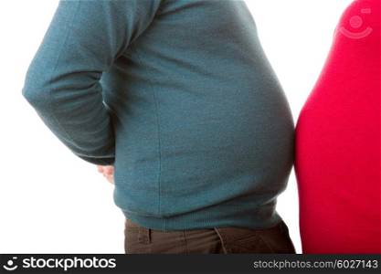 Pregnant woman with her husband, close up on the belly