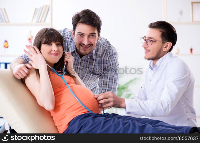 Pregnant woman with her husband visiting the doctor in clinic