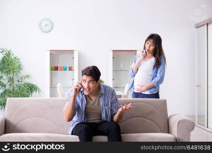 Pregnant woman with husband at home