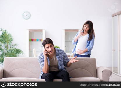 Pregnant woman with husband at home