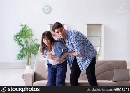 Pregnant woman with husband at home