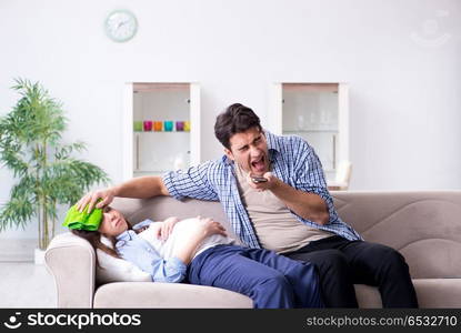 Pregnant woman with husband at home