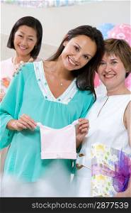Pregnant Woman with Mature Women at a Baby Shower