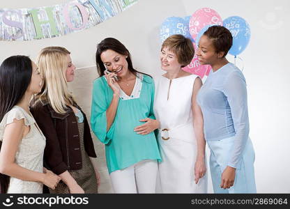 Pregnant Woman with Mobile Phone at a Baby Shower