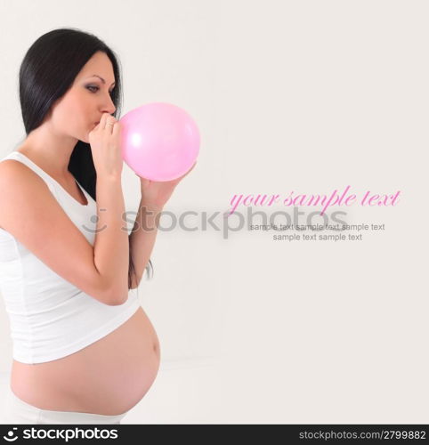 pregnant woman with pink balloon