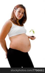 Pregnant woman with young plant in hand dressed in white and black, isolated