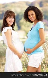 Pregnant women outdoors in countryside