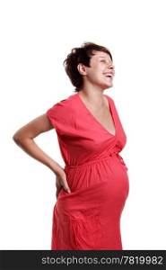 Pregnant young woman in a red shirt on the white background