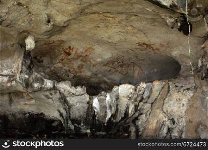Prehistoric paintings on the wall of cave in Phang Nga, Thailand
