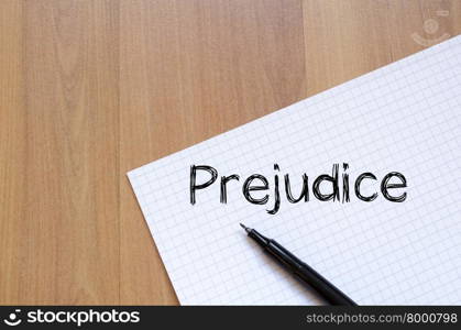 Prejudice text concept write on notebook with pen