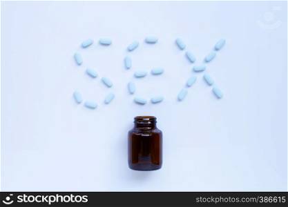 ""PrEP" ( Pre-Exposure Prophylaxis). used to prevent HIV. Sex word made of blue medicine pills."