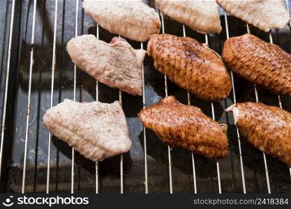 preparation chicken wings metal grill