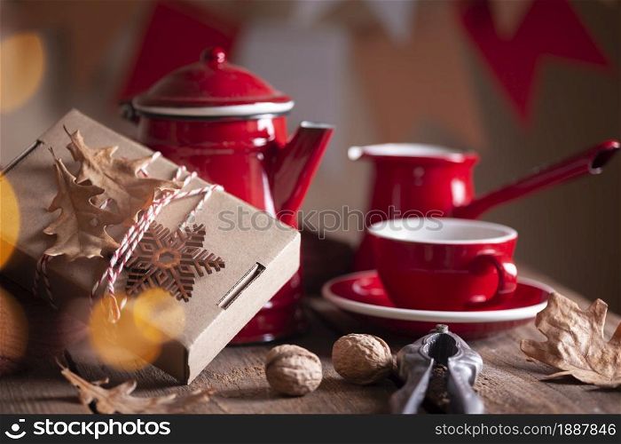 preparation for the holiday - a gift on a red background. christmas still life.