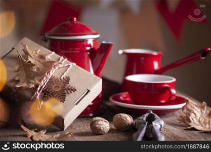 preparation for the holiday - a gift on a red background. christmas still life.