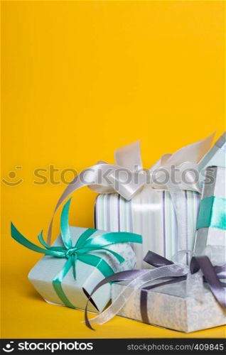 preparation for the holiday - a group of gifts on a yellow background