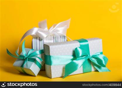 preparation for the holiday - a group of gifts on a yellow background. Birthday