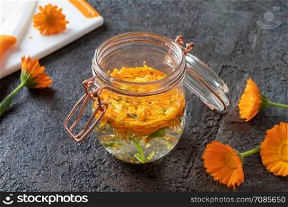 Preparation of herbal tincture from blooming calendula plant