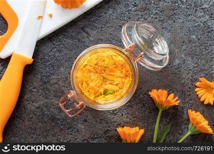 Preparation of herbal tincture from fresh calendula flowers, top view
