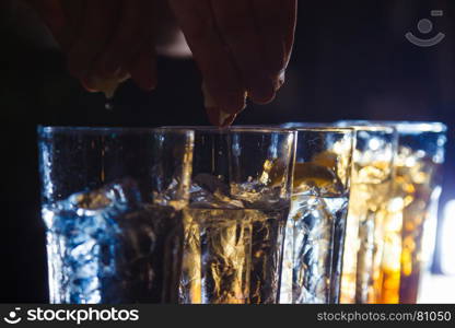 Preparation of long cocktails. Close-up