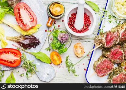 Preparation of meat skewers with vegetables ingredients on light wooden background, top view