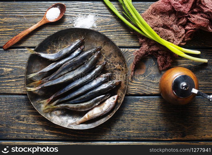 preparation of raw smelt fish, raw smelt fish on plate